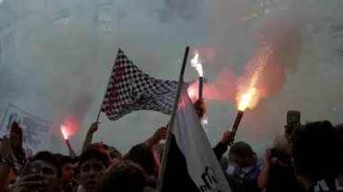 Fans celebrate their favorite team's.Fans celebrate their favorite team's Championships by lighting torches.