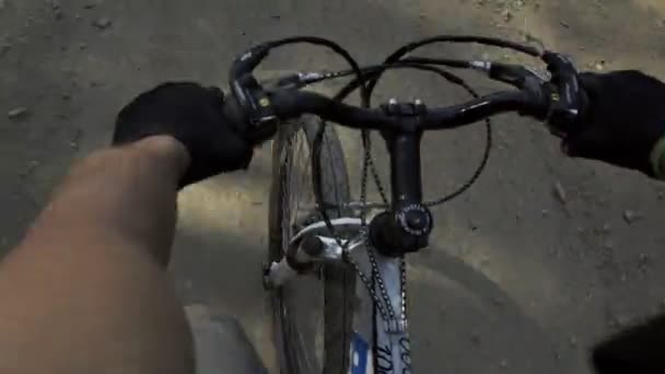 Cyclist Holding Steering Wheel Man Rides Bicycle Dirt Road Forest — 图库视频影像