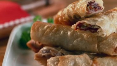 A traditional pastry on a serving plate.Delicious traditional Turkish pastry with pastrami. Macro, 4K, Phantom Camera, Super Close Up.