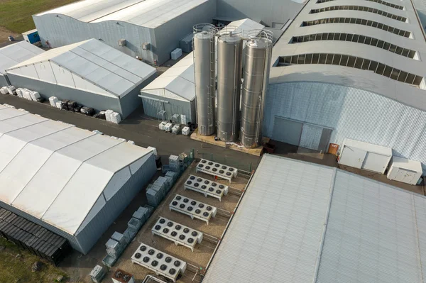 Aerial view of new factory building for producing and shipping of industrial equipment.