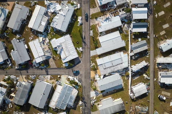 stock image Severely damaged by hurricane Ian houses in Florida mobile home residential area. Consequences of natural disaster.