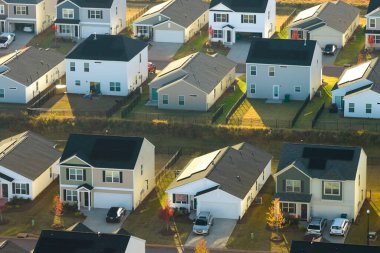 Aerial view of tightly packed homes in South Carolina residential area. New family houses as example of real estate development in american suburbs. clipart