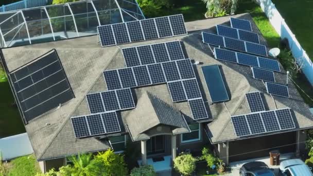 Standard American Residential House Rooftop Covered Solar Photovoltaic Panels Producing — kuvapankkivideo