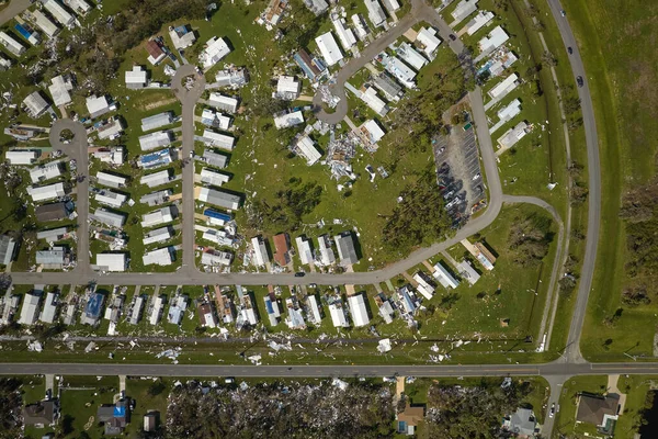 stock image Severely damaged houses after hurricane Ian in Florida mobile home residential area. Consequences of natural disaster.