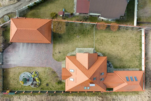 Aerial view of residential house with backyard in suburban rural area.