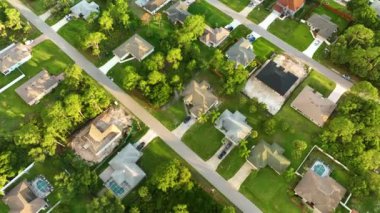 Aerial view of suburban private house wit wooden roof frame under construction in Florida quiet rural area.