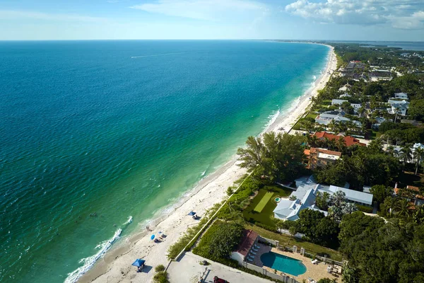 Aerial view of expensive residential houses in island small town Boca Grande on Gasparilla Island in southwest Florida. American dream homes as example of real estate development in US suburbs.