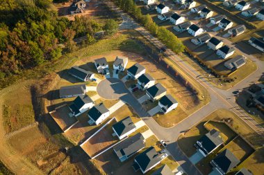 Aerial view of cul-de-sac at neighborhood street dead end with tightly packed homes in South Carolina living aeria. Family houses as example of real estate development in american suburbs. clipart