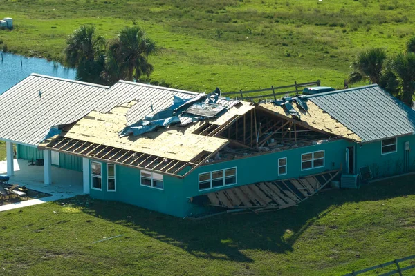Hurricane Ian destroyed house in Florida residential area. Natural disaster and its consequences.