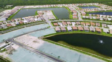 High angle view of residential development area with tightly located family houses under construction in Florida suburbs. Concept of growing american real estate market.