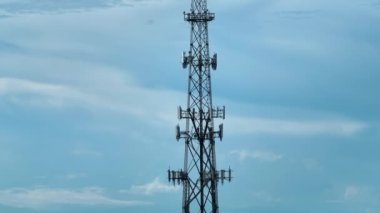 Tall telecommunication radio cell tower with wireless communication 5g antennas for network signal transmission.