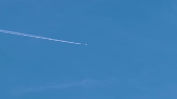 Distant Passenger Jet Plane Flying High Altitude Clear Blue Sky — Stock Video