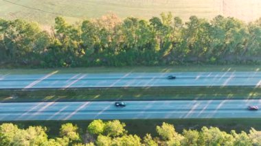 Aerial view of busy american highway with fast moving traffic. Interstate transportation concept.