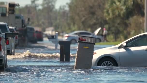 Flooded Town Street Moving Cars Submerged Water Florida Residential Area — Stockvideo