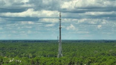 Tall telecommunication radio cell tower with wireless communication 5g antennas for network signal transmission.