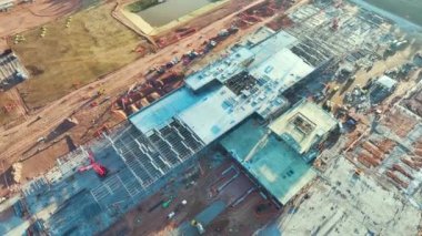 Construction site of new large factory complex under development. Assembly of future commercial facility. Growth of global production concept.