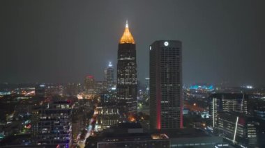 Night urban landscape of downtown district of Atlanta city in Georgia, USA. Skyline with brightly illuminated high skyscraper buildings in modern american megapolis. Atlanta, USA - October 23, 2022.