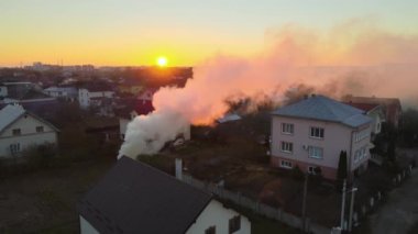 Aerial view of agricultural waste bonfires from dry grass and straw stubble burning with thick smoke polluting air during dry season causing carcinogen fumes.
