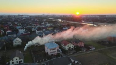 Aerial view of agricultural waste bonfires from dry grass and straw stubble burning with thick smoke polluting air causing global warming and carcinogen fumes.