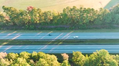Aerial view of busy american highway with fast moving traffic. Interstate transportation concept.