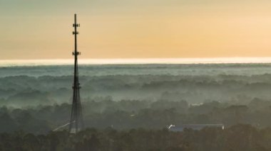 Tall telecommunication radio cell tower with wireless communication 5g antennas for network signal transmission.