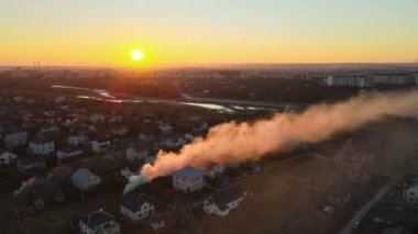 Agricultural waste bonfires from dry grass and straw stubble burning with thick smoke polluting air during dry season on farmlands causing carcinogen fumes.