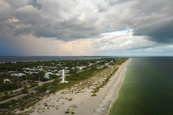 Aerial view of tropical storm over expensive residential houses in island small town Boca Grande on Gasparilla Island in southwest Florida.