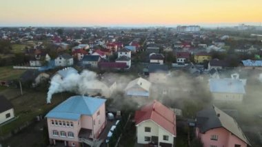 Aerial view of waste bonfires from dry grass and straw stubble burning with smoke polluting air during dry season causing global warming and carcinogen fumes.