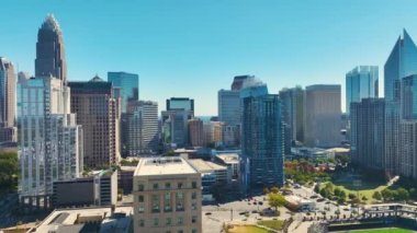 Urban landscape of downtown district of Charlotte city in North Carolina, USA. Skyline with high skyscraper buildings in modern american megapolis.