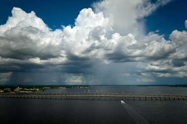 Barron Collier Bridge and Gilchrist Bridge in Florida with moving traffic. Transportation infrastructure in Charlotte County connecting Punta Gorda and Port Charlotte over Peace River.