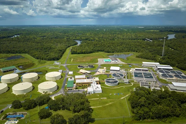 stock image Aerial view of modern water cleaning facility at urban wastewater treatment plant. Purification process of removing undesirable chemicals, suspended solids and gases from contaminated liquid.