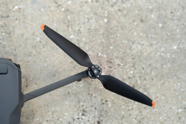 Closeup of motor and propeller of drone quadcopter for taking video and pictures. Preflight checking of before takeoff.