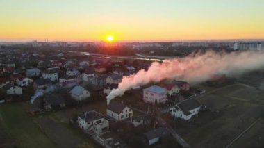 Aerial view of agricultural waste bonfires from dry grass and straw stubble burning with thick smoke polluting air causing global warming and carcinogen fumes.