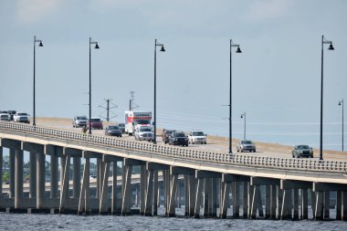 Barron Collier Bridge and Gilchrist Bridge in Florida with moving traffic. Transportation infrastructure in Charlotte County connecting Punta Gorda and Port Charlotte over Peace River.