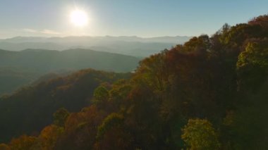 Aerial view of high hills in Appalachian mountains with yellow woods in fall season. Amazing scenery of wild american mountain woodland.