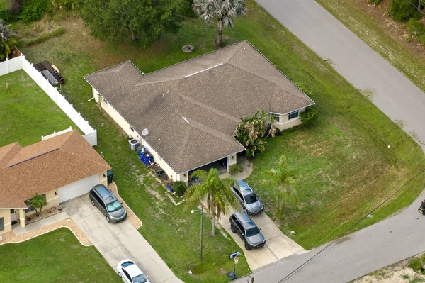 stock image Aerial landscape view of suburban private houses between green palm trees in Florida quiet rural area.