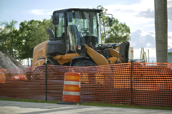 stock image Restriction plastic mesh fence at industrial construction site. Protective barrier for pedestrians safety.