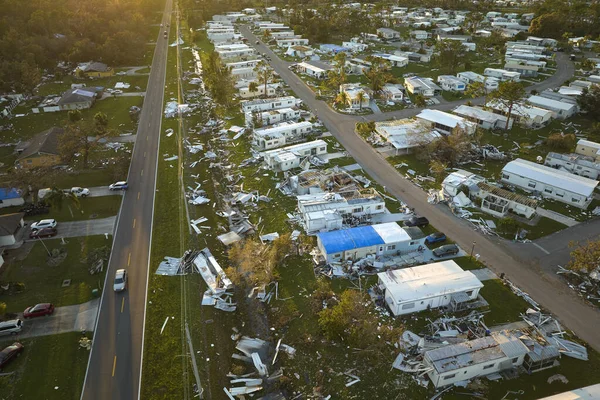 stock image Severely damaged houses after hurricane Ian in Florida mobile home residential area. Consequences of natural disaster.