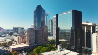 Aerial view of downtown district of Charlotte city in North Carolina, USA. Glass and steel high skyscraper buildings in modern american midtown.