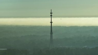 Tall telecommunication radio cell tower with wireless communication 5g antennas for network signal transmission.