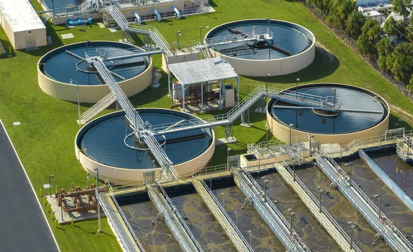 stock image Aerial view of modern water cleaning facility at urban wastewater treatment plant. Purification process of removing undesirable chemicals, suspended solids and gases from contaminated liquid.