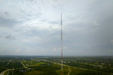 Tall telecommunication radio cell tower with wireless communication 5g antennas for network signal transmission.