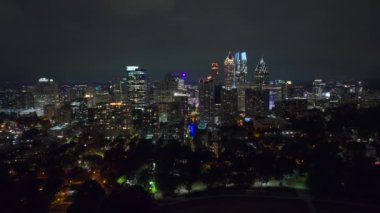 Night urban landscape of downtown district of Atlanta city in Georgia, USA. Skyline with brightly illuminated high skyscraper buildings in modern american megapolis.