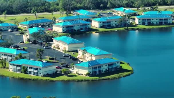 Aerial View Damaged Hurricane Ian Apartment Building Roofs Covered Blue — Stock Video