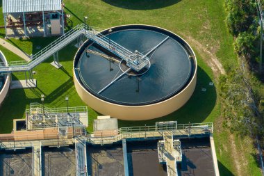 Aerial view of modern water cleaning facility at urban wastewater treatment plant. Purification process of removing undesirable chemicals, suspended solids and gases from contaminated liquid.