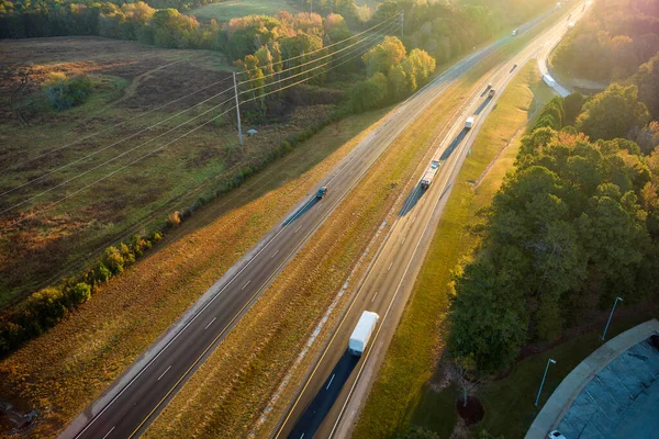 stock image View from above of busy american highway with fast moving trucks and cars. Interstate transportation concept.