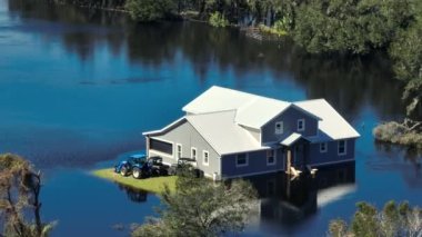 Flooded farm house by hurricane Ian rainfall in Florida residential area. Consequences of natural disaster.