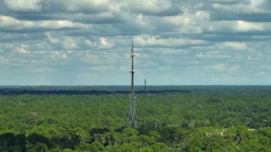 Tall telecommunication radio cell tower with wireless communication 5g antennas for network signal transmission.