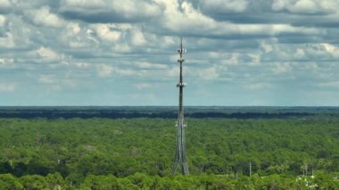 Tall telecommunication radio cell tower with wireless communication 5g antennas for network signal transmission.