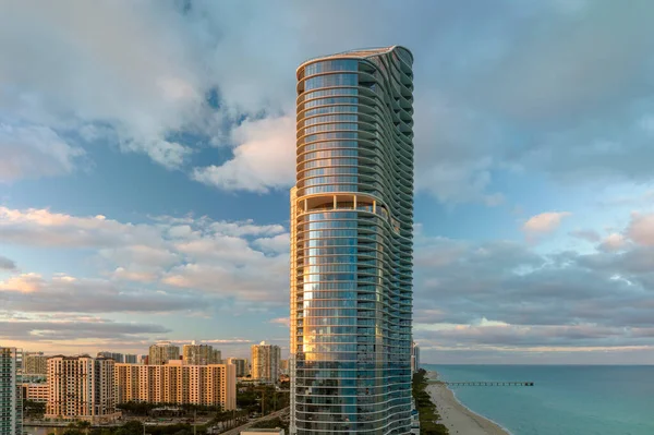 stock image View from above of luxurious highrise hotels and condos on Atlantic ocean shore in Sunny Isles Beach city in the evening. American tourism infrastructure in southern Florida.